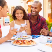 A family enjoying dinner at one of the many family friends restaurants in San Diego