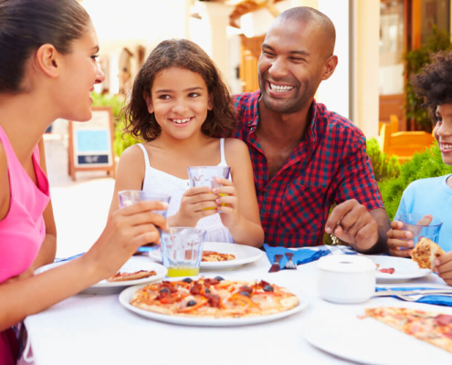 A family enjoying dinner at one of the many family friends restaurants in San Diego