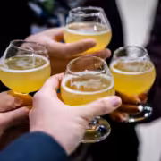 Friends toasting on one of San Diego's brewery tours