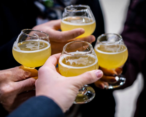 Friends toasting on one of San Diego's brewery tours