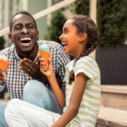 A family enjoy ice cream outside of one of San Diego's best ice cream shops