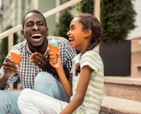 A family enjoy ice cream outside of one of San Diego's best ice cream shops
