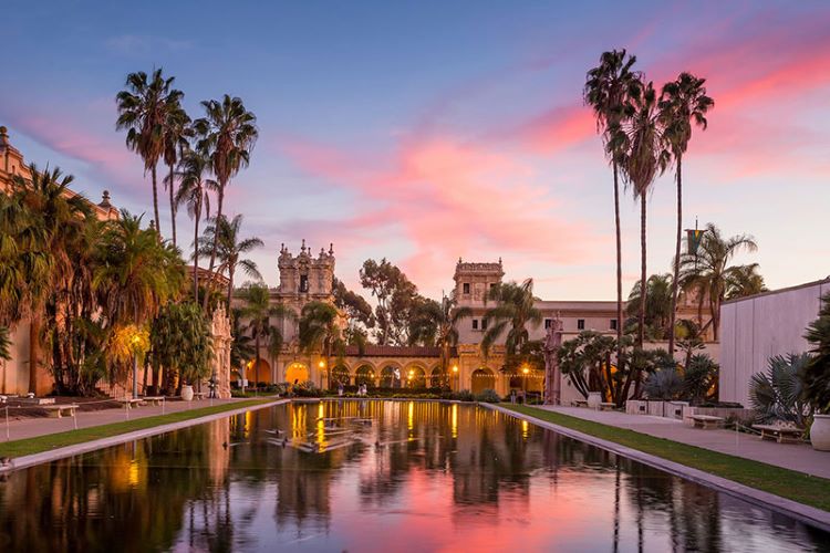 View of the sunset reflecting off the water in front of the Botanical gardens at Balboa Park